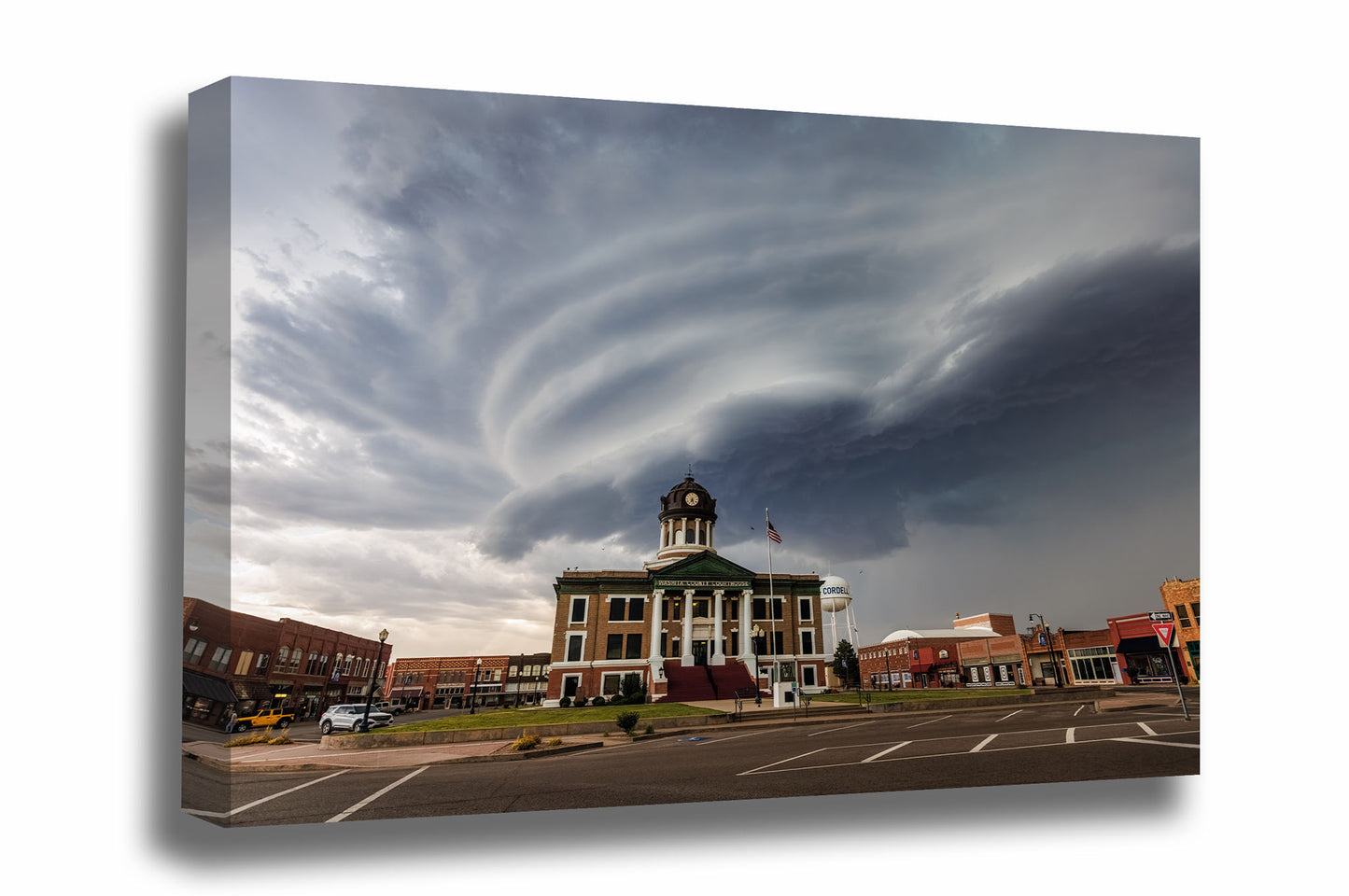 Storm gallery wrapped canvas wall art of a striated supercell thunderstorm advancing over the Washita County courthouse in Cordell, Oklahoma by Sean Ramsey of Southern Plains Photography.