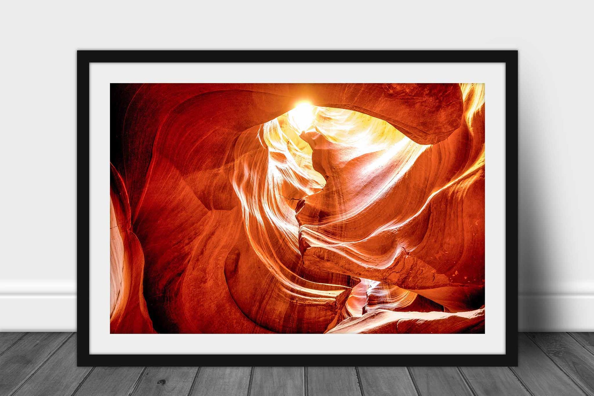 Framed Antelope Canyon print of sunlight shining through an opening in the slot canyon walls in the Arizona desert by Sean Ramsey of Southern Plains Photography.