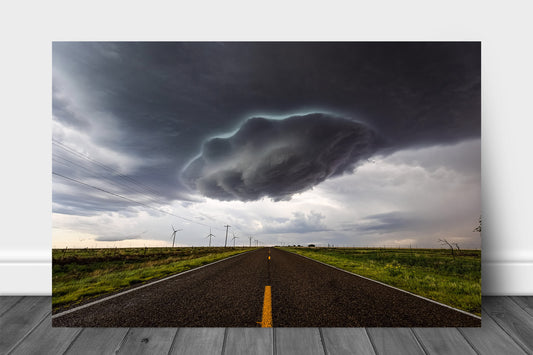 Storm aluminum metal print wall art of a supercell thunderstorm wall cloud appearing as a UFO over a highway on a stormy spring day in New Mexico by Sean Ramsey of Southern Plains Photography.