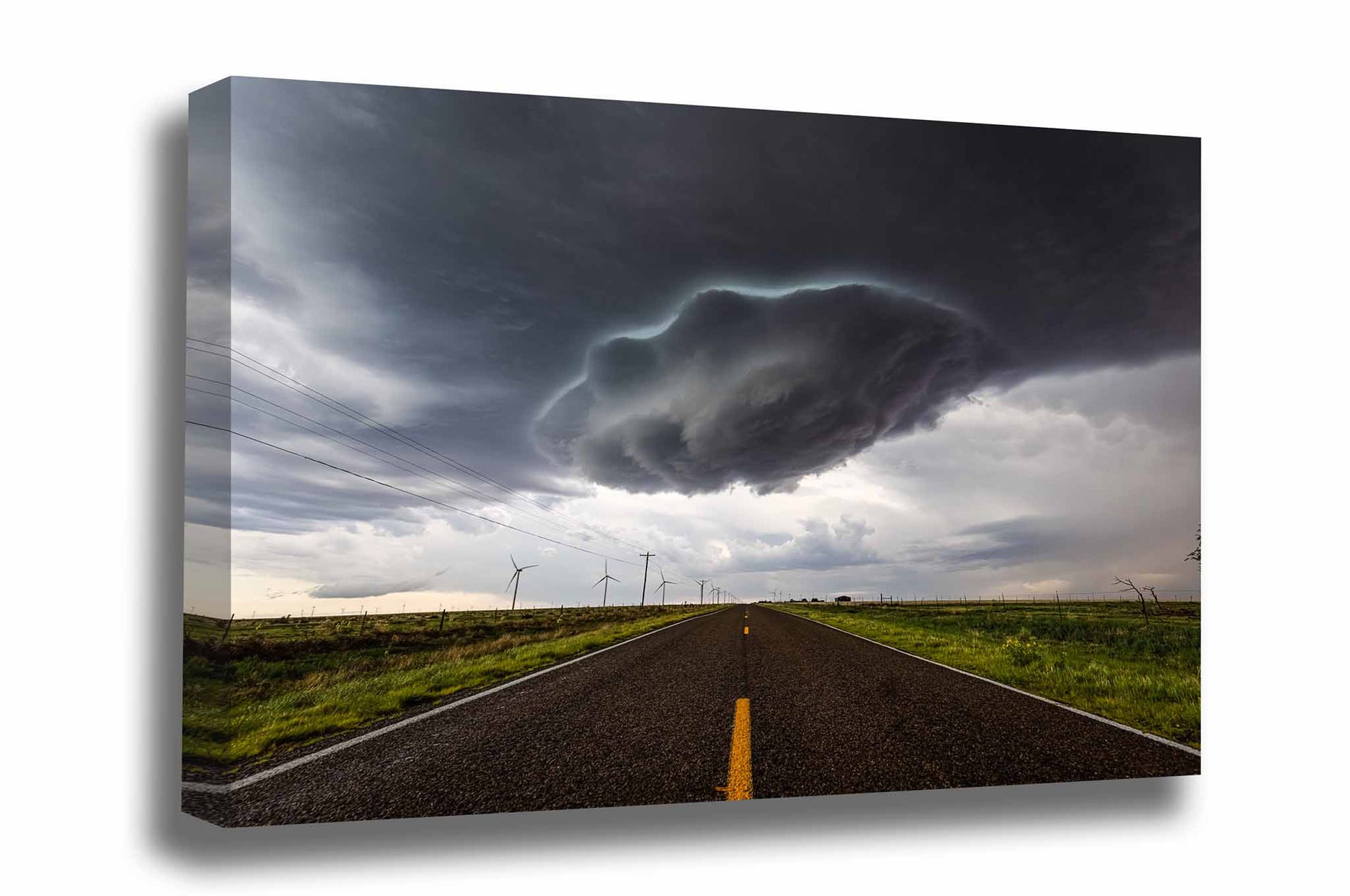 Storm canvas wall art of a supercell thunderstorm wall cloud appearing as a UFO over a highway on a stormy spring day in New Mexico by Sean Ramsey of Southern Plains Photography.