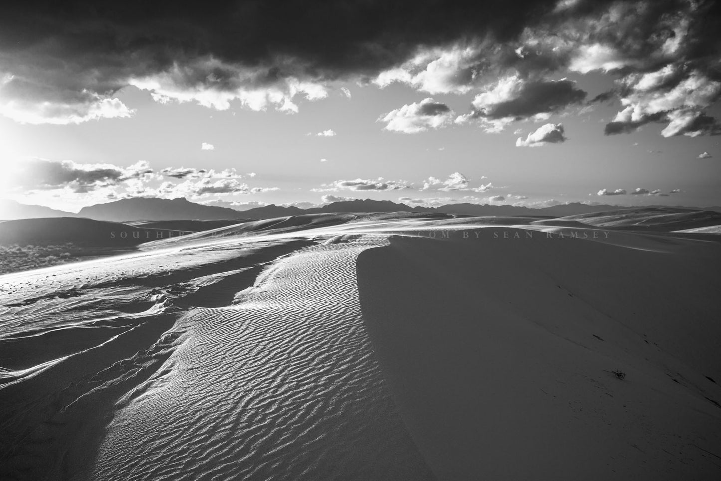 Desert photography print of sand dunes in sunlight at White Sands National Park, New Mexico in black and white by Sean Ramsey of Southern Plains Photography.