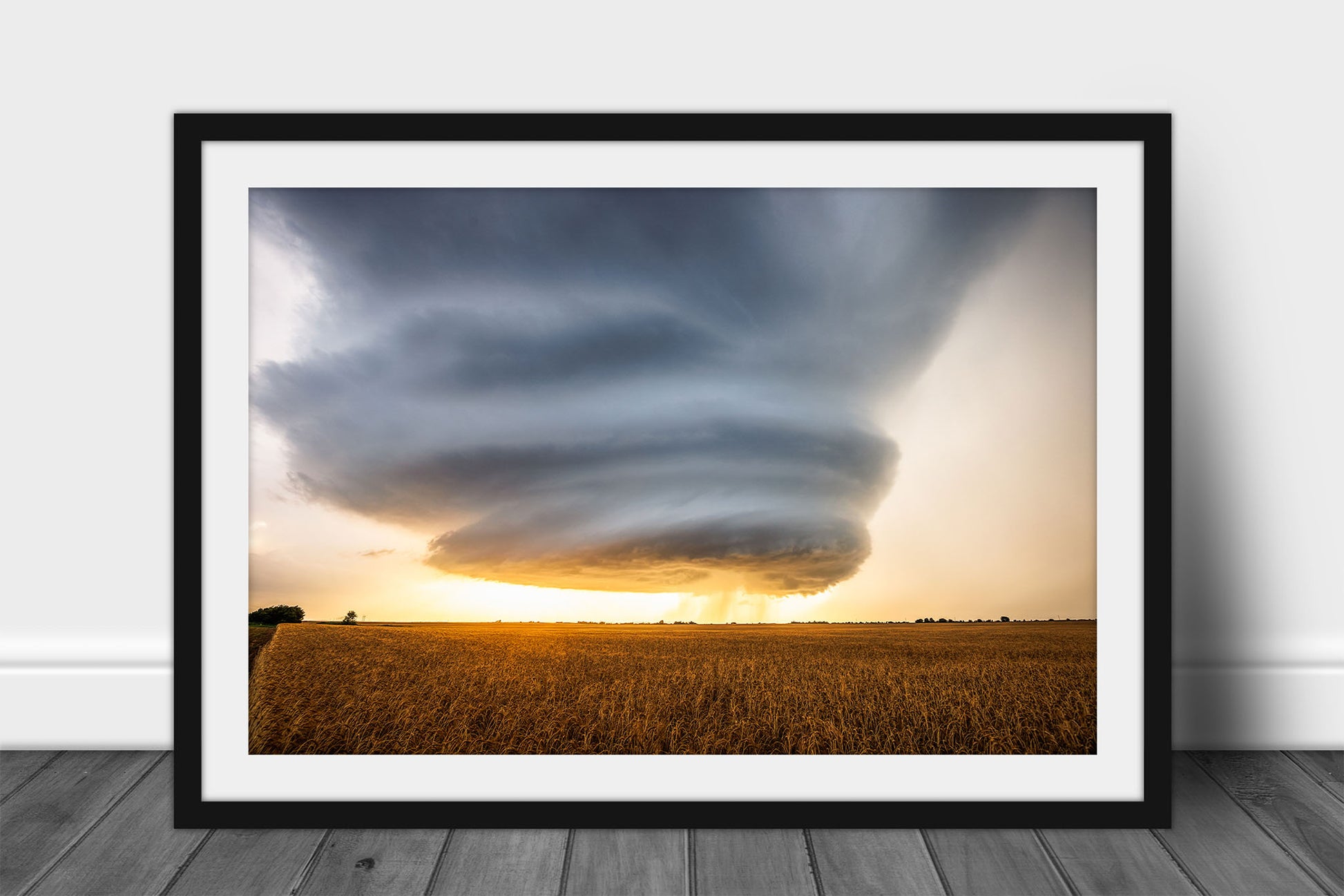 Framed and matted storm print of a sculpted supercell thunderstorm over a golden wheat field at sunset on a stormy evening in Oklahoma by Sean Ramsey of Southern Plains Photography.