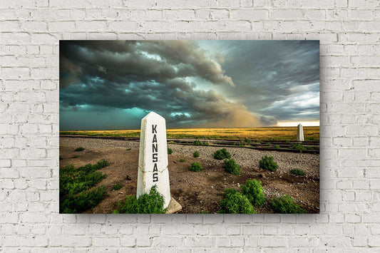 Great Plains metal print of a storm advancing past a railroad post on a spring day at the state line of Colorado and Kansas by Sean Ramsey of Southern Plains Photography.