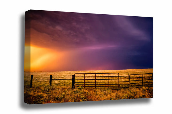 Western canvas wall art of a colorful stormy sky over a fence gate on a summer day in Oklahoma by Sean Ramsey of Southern Plains Photography.