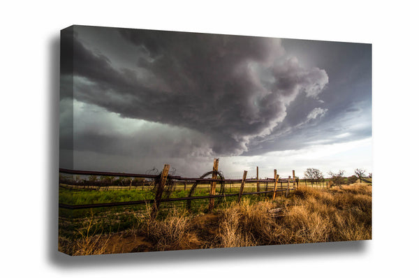 Western canvas wall art of a thunderstorm advancing over a barbed wire fence on a stormy spring day in Oklahoma by Sean Ramsey of Southern Plains Photography.