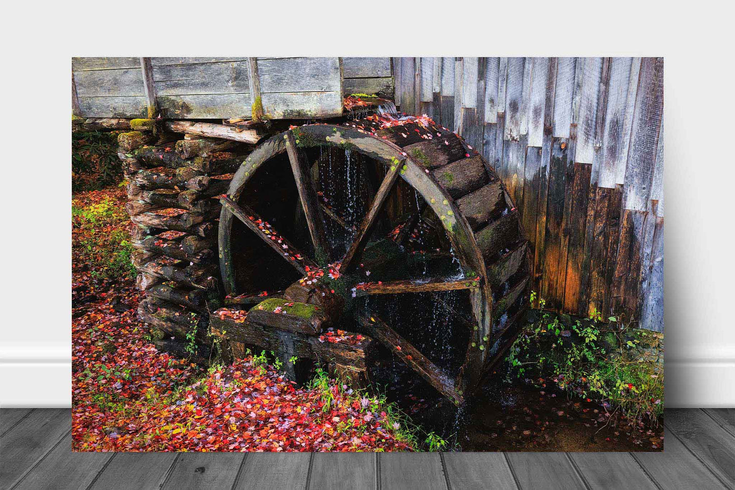 Rustic country aluminum metal print wall art of an old grist mill wheel covered in fallen leaves on an autumn day in the Great Smoky Mountains of Tennessee by Sean Ramsey of Southern Plains Photography.