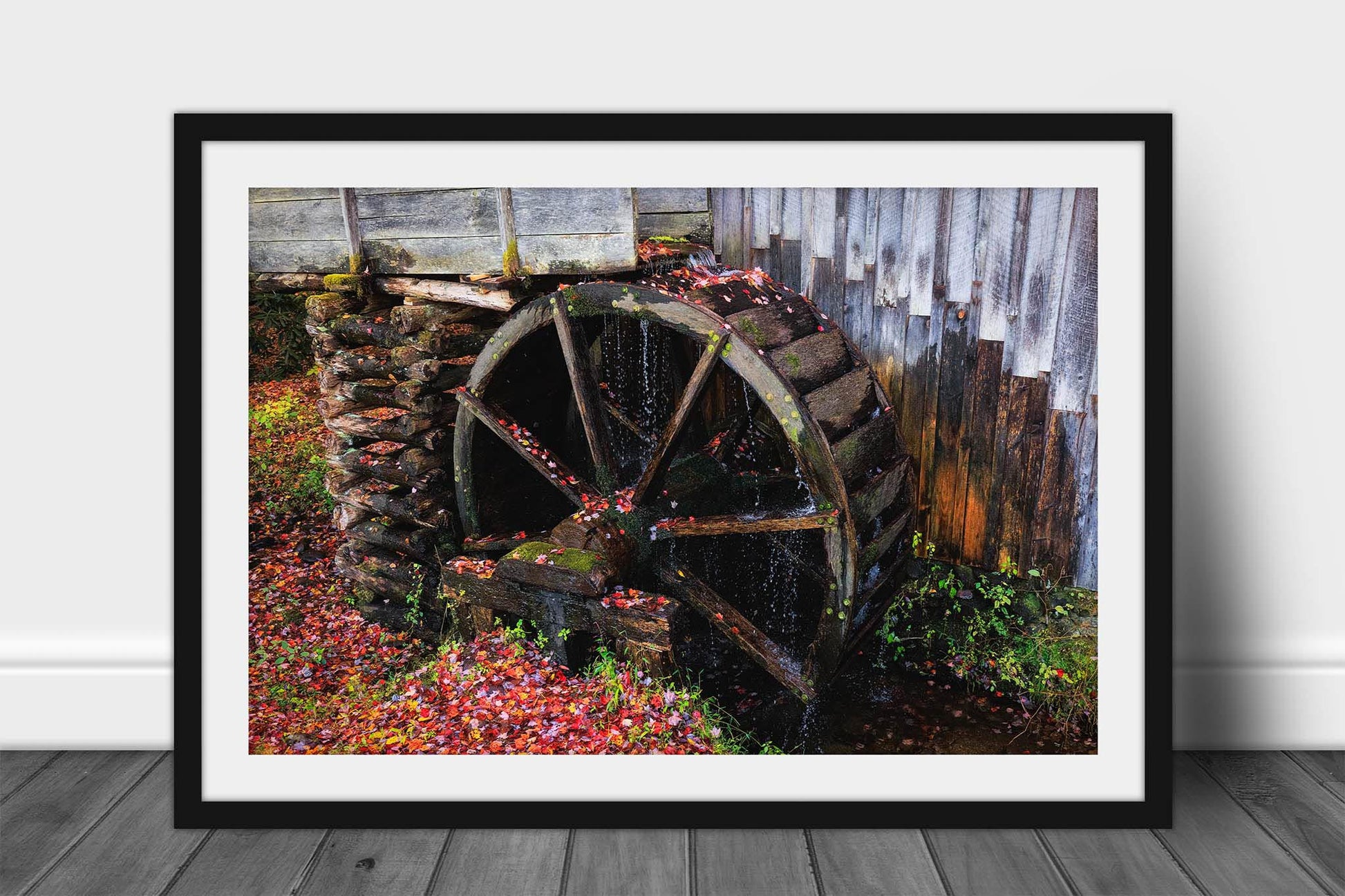Rustic country framed print of an old grist mill wheel covered in fallen leaves on an autumn day in the Great Smoky Mountains of Tennessee by Sean Ramsey of Southern Plains Photography.