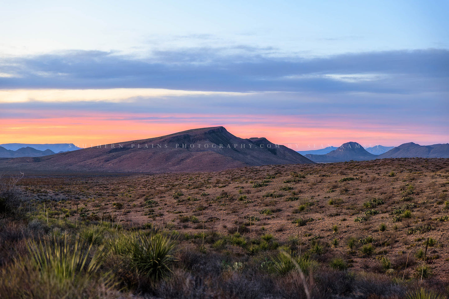 Desert landscape photography print of mountains and mesas in the warm light of sunset on a spring evening in Big Bend National Park in West Texas by Sean Ramsey of Southern Plains Photography.