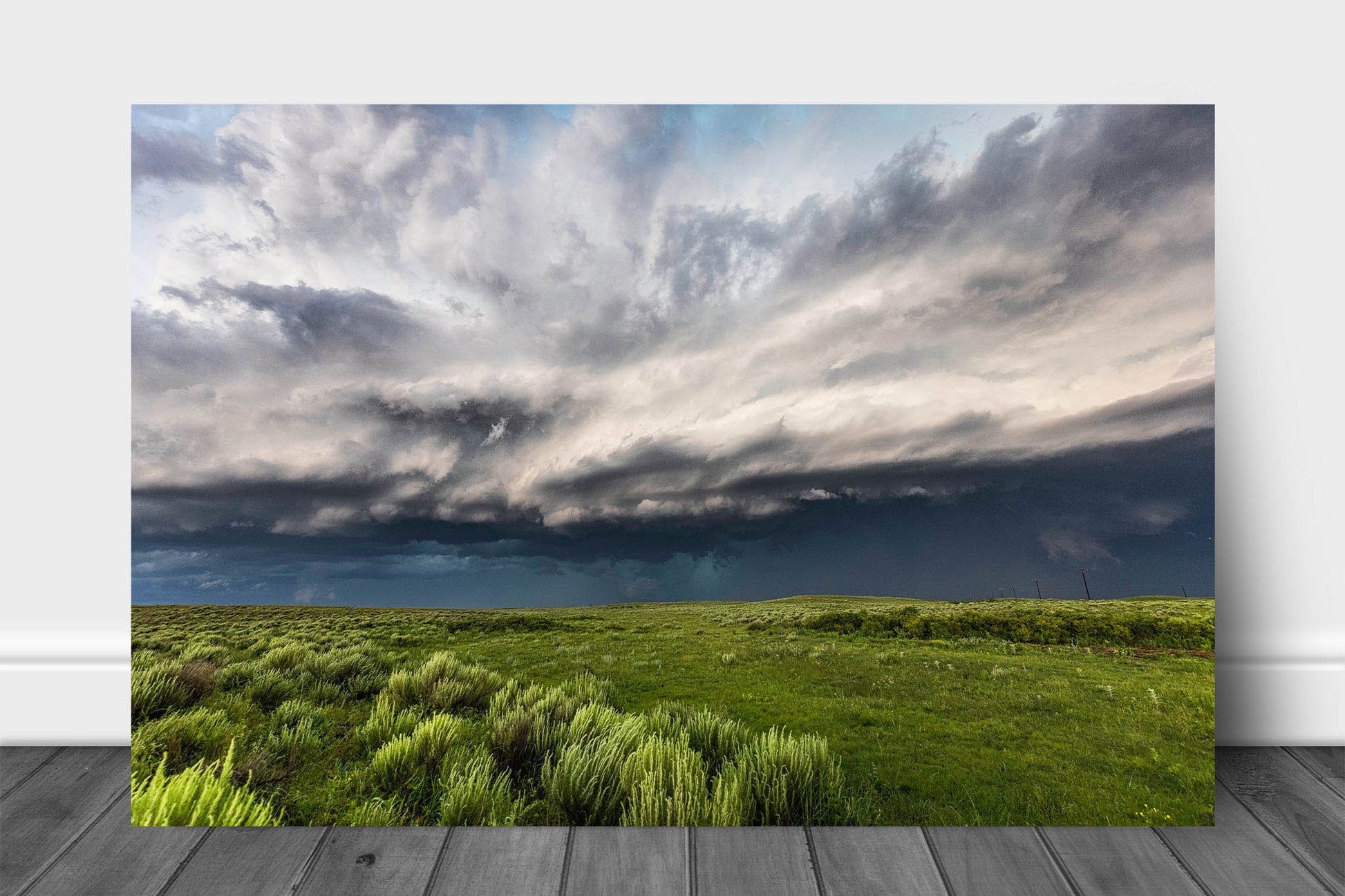 Great Plains aluminum metal print wall art of a thunderstorm filling the sky with dramatic storm clouds over prairie on a spring day in Oklahoma by Sean Ramsey of Southern Plains Photography.