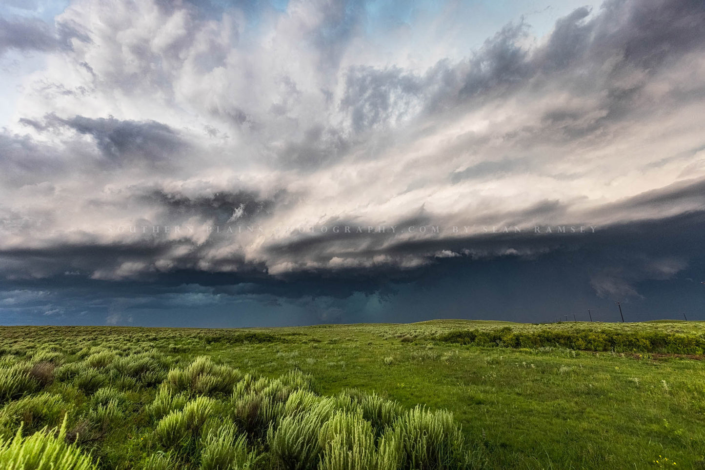 Great Plains photography print of a thunderstorm filling the sky with dramatic storm clouds over prairie on a spring day in Oklahoma by Sean Ramsey of Southern Plains Photography.