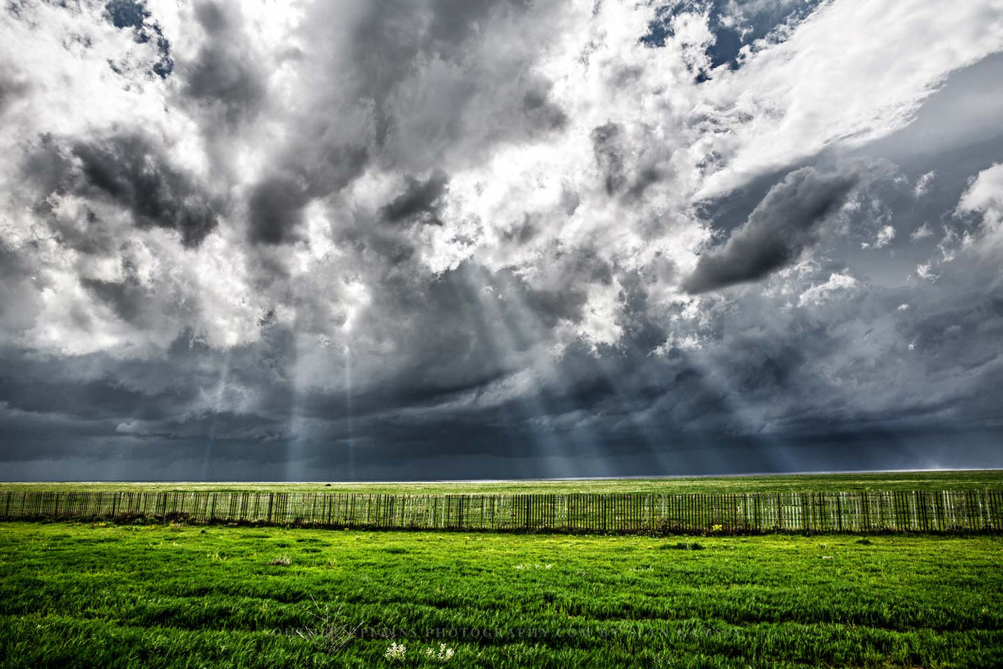 Great Plains photography print of sunbeams bursting through storm clouds onto the plains on a stormy spring day in Colorado by Sean Ramsey of Southern Plains Photography.