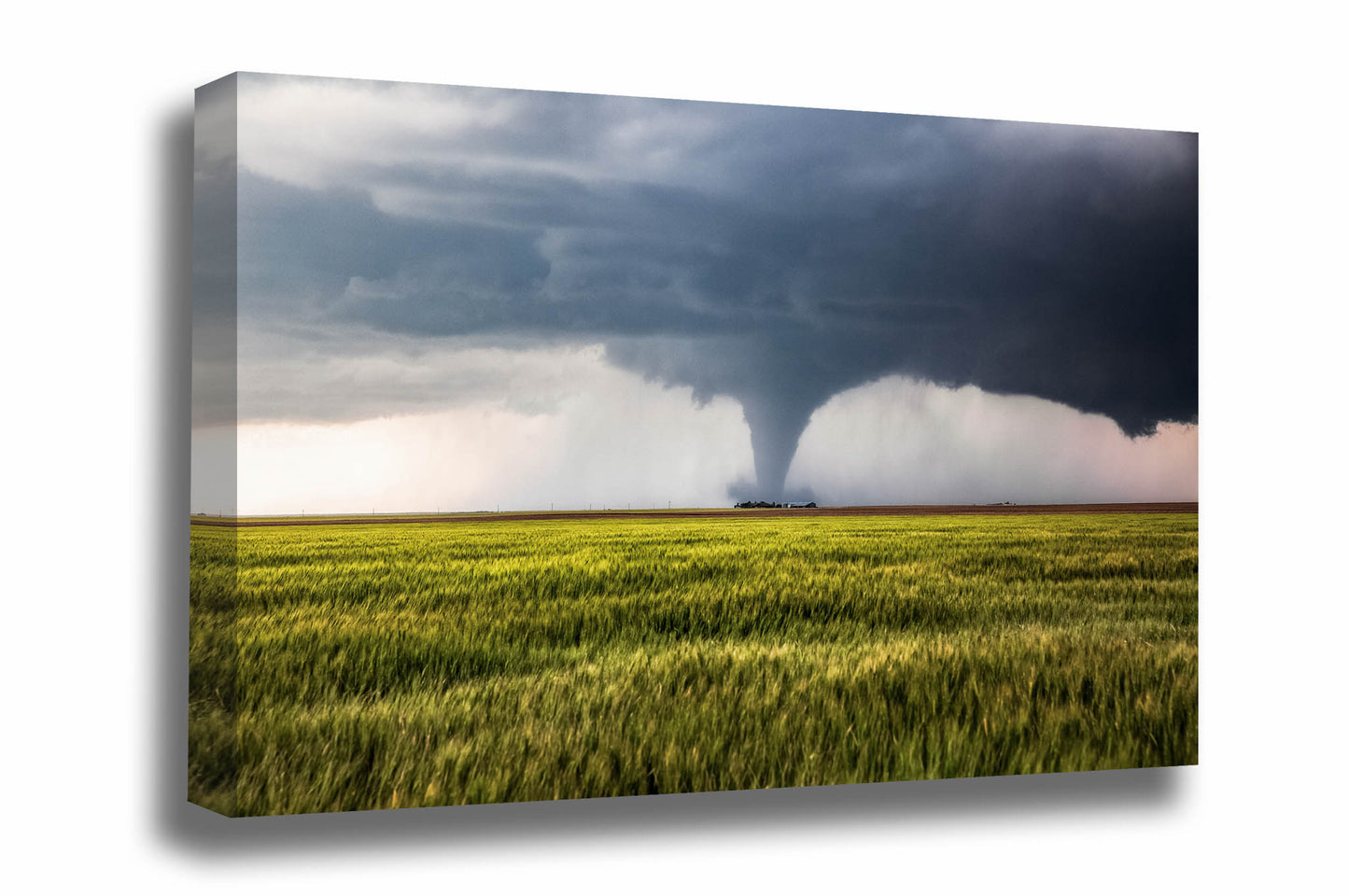 Storm canvas wall art of a large tornado over a wheat field passing behind a farmhouse on a stormy spring day on the plains of Kansas by Sean Ramsey of Southern Plains Photography.