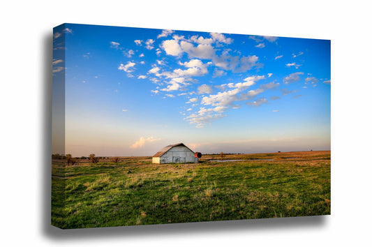 Country canvas wall art of a rustic white barn sitting under a big blue sky at sunset on a spring evening in Oklahoma by Sean Ramsey of Southern Plains Photography.