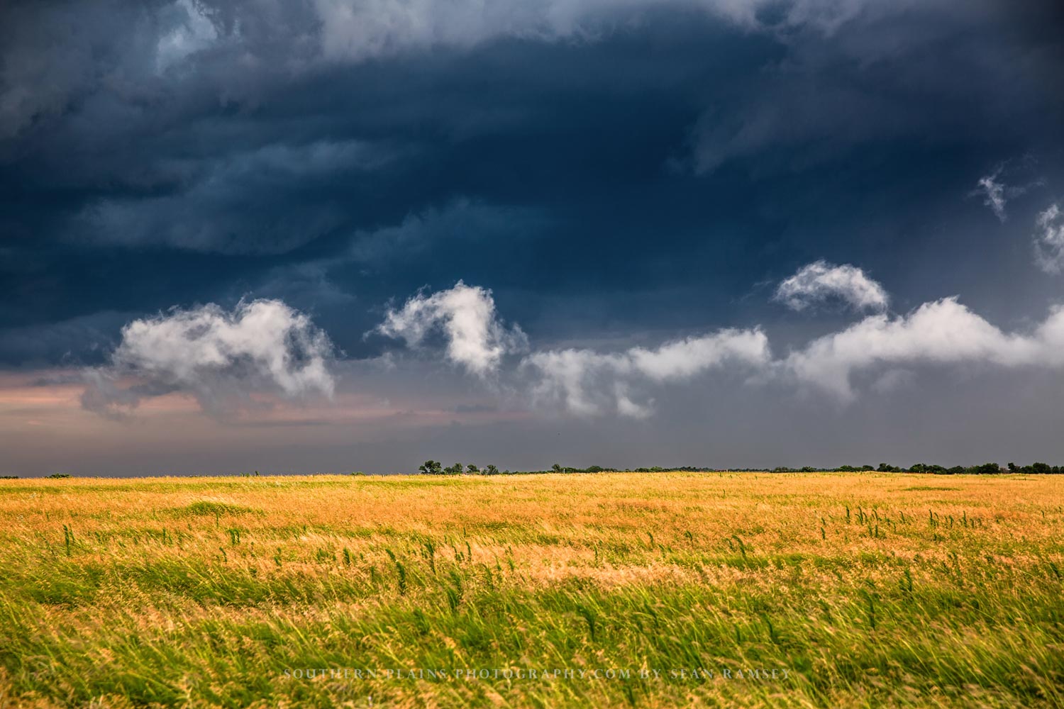 Nature photography print of clouds in various shapes marching over a field after a stormy day on the plains of Oklahoma by Sean Ramsey of Southern Plains Photography.