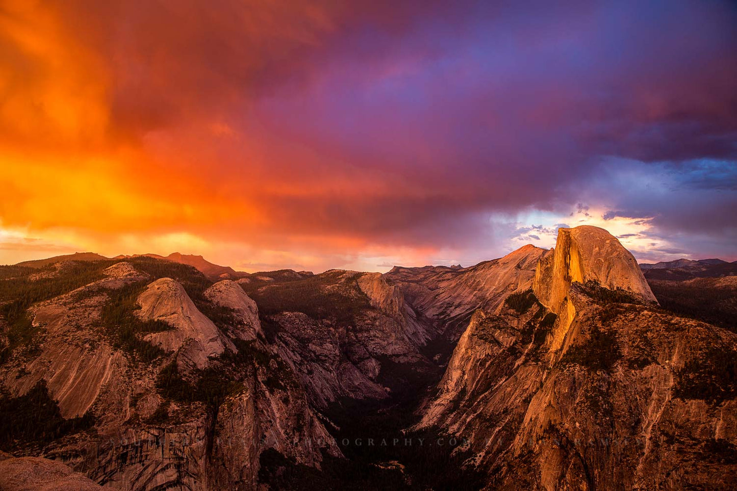 Landscape photography print of colorful storm clouds over Half Dome and Yosemite Valley on a stormy evening in Yosemite National Park, California by Sean Ramsey of Southern Plains Photography.