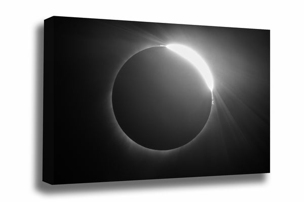 Celestial canvas wall art in black and white of a total solar eclipse with the "Diamond Ring Effect" as it exits totality in the Nebraska sky by Sean Ramsey of Southern Plains Photography.
