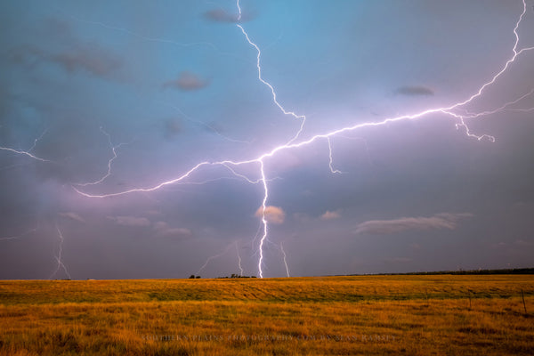 Storm photography print of lightning spanning the sky and striking at dusk on the plains of Oklahoma by Sean Ramsey of Southern Plains Photography.