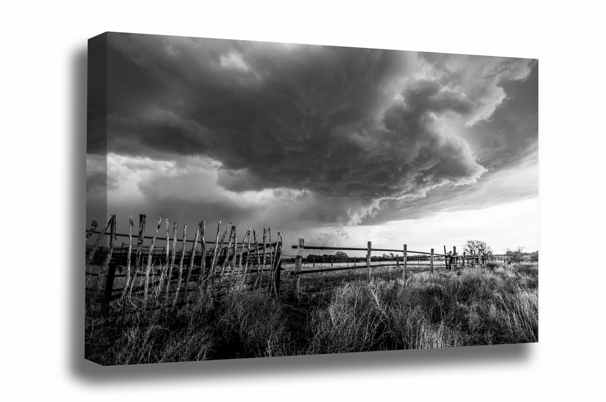 Black and white canvas wall art of a thunderstorm advancing over an old rickety fence on a ranch in western Oklahoma by Sean Ramsey of Southern Plains Photography.