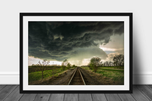 Framed and matted storm photography print of dark storm clouds over railroad tracks on a stormy spring day in Kansas by Sean Ramsey of Southern Plains Photography.