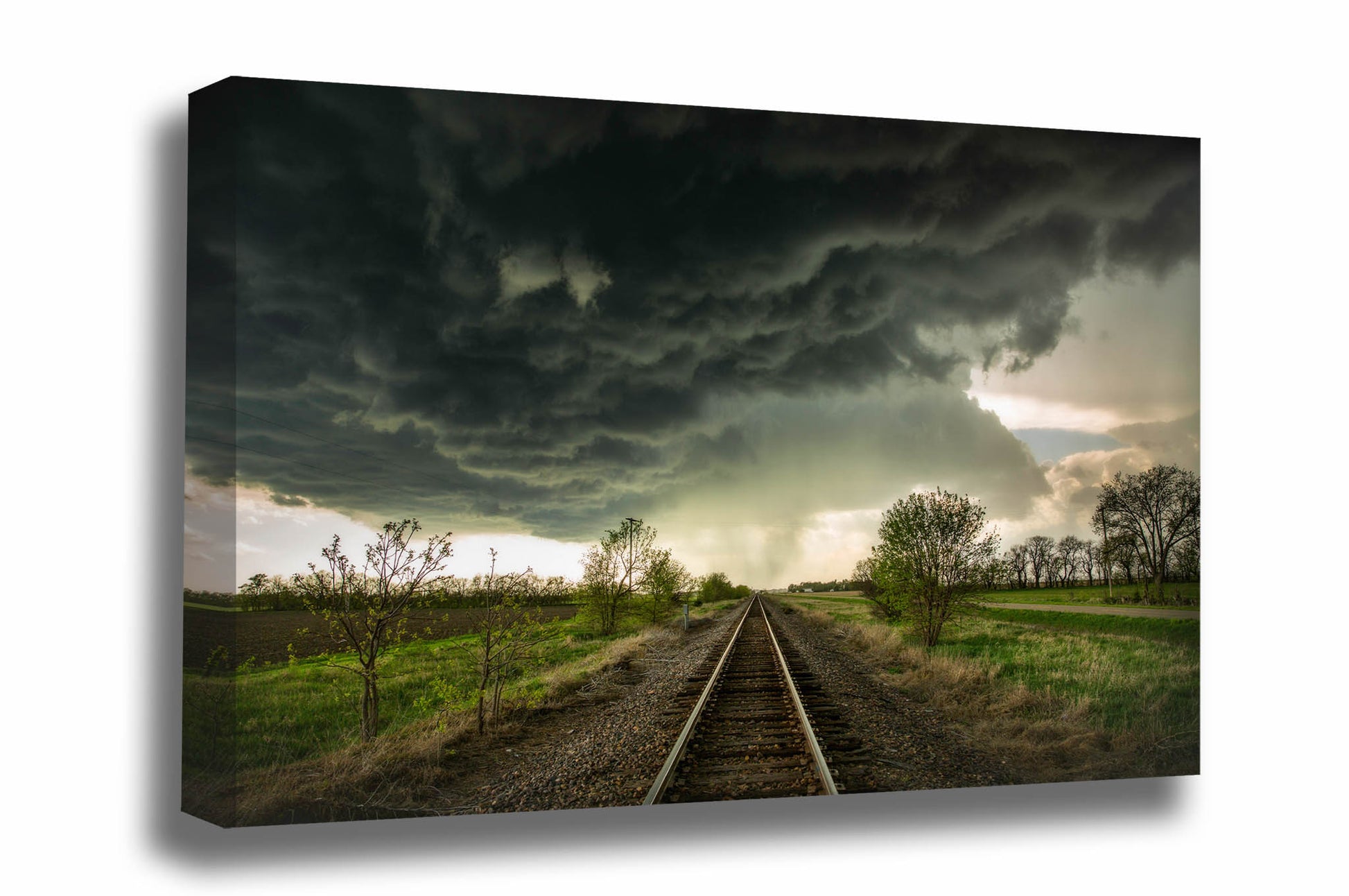 Thunderstorm canvas wall art of dark storm clouds over railroad tracks on a stormy spring day in Kansas by Sean Ramsey of Southern Plains Photography.