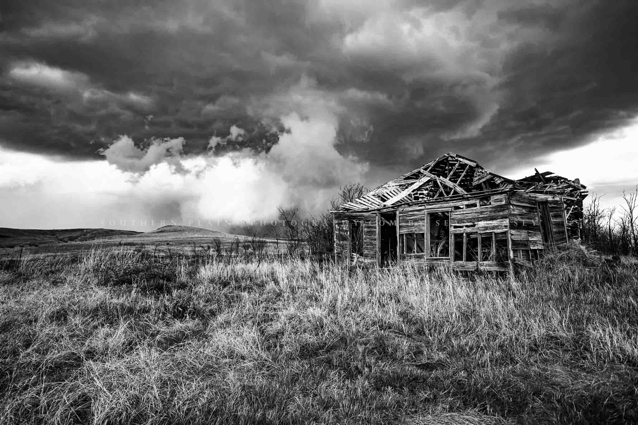 Black and white country photography print of an abandoned homestead on a stormy spring day in Kansas by Sean Ramsey of Southern Plains Photography.