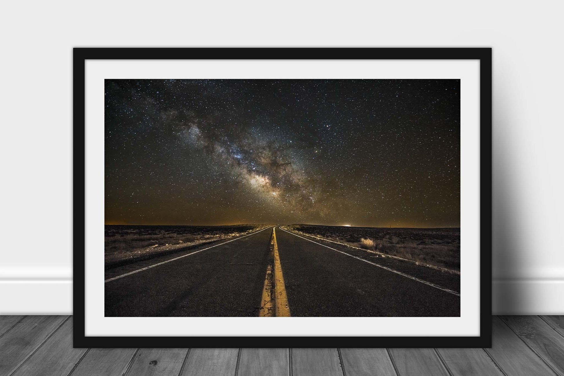 Framed wanderlust print with optional mat of a highway leading to the Milky Way rising above the horizon on a starry night in the Arizona desert by Sean Ramsey of Southern Plains Photography.
