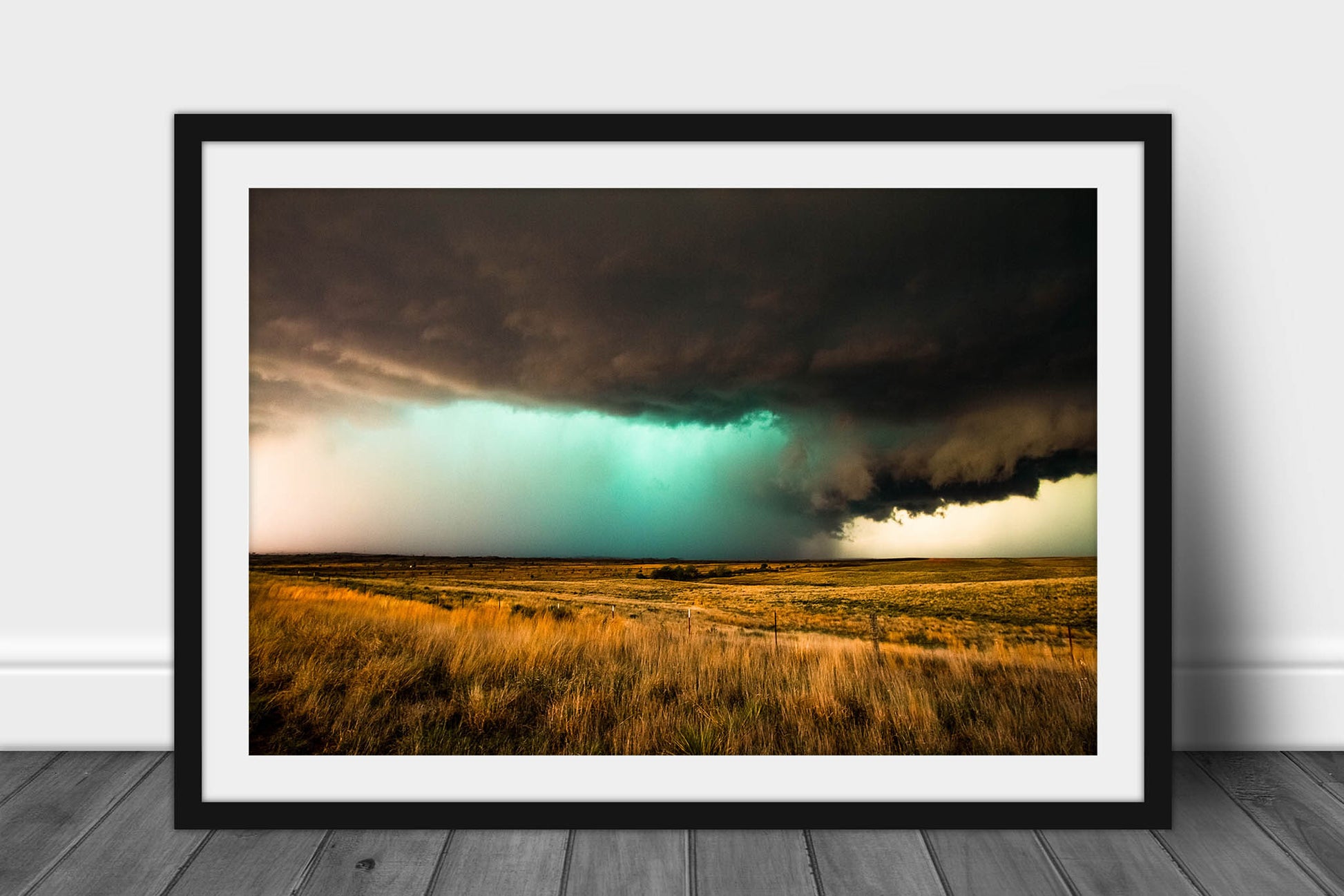 Framed and matted storm photography print of a supercell thunderstorm with a teal hue over open prairie on a spring day in the Texas Panhandle by Sean Ramsey of Southern Plains Photography.