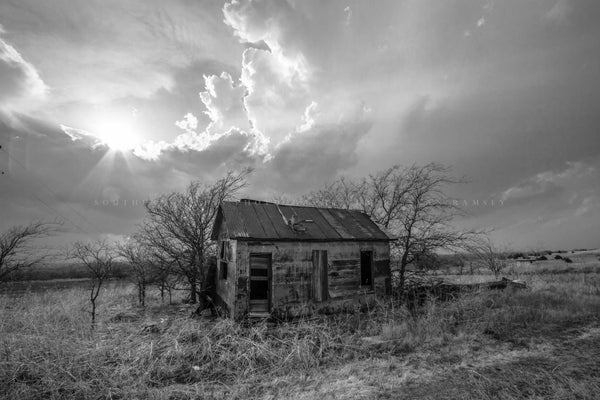 Black and White Great Plains photography print of an abandoned homestead under a stormy sky on the Kansas prairie by Sean Ramsey of Southern Plains Photography.