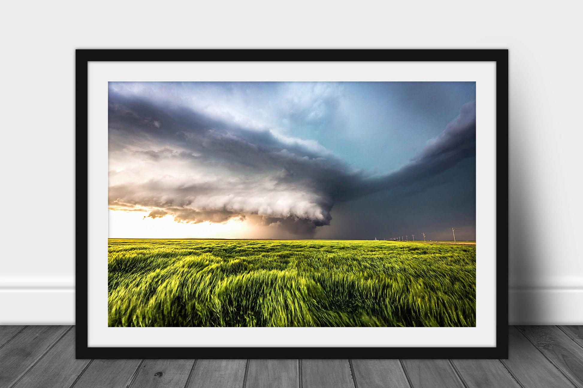 Framed storm photography print of a supercell thunderstorm over a waving wheat field on a stormy spring day on the plains of Kansas by Sean Ramsey of Southern Plains Photography.