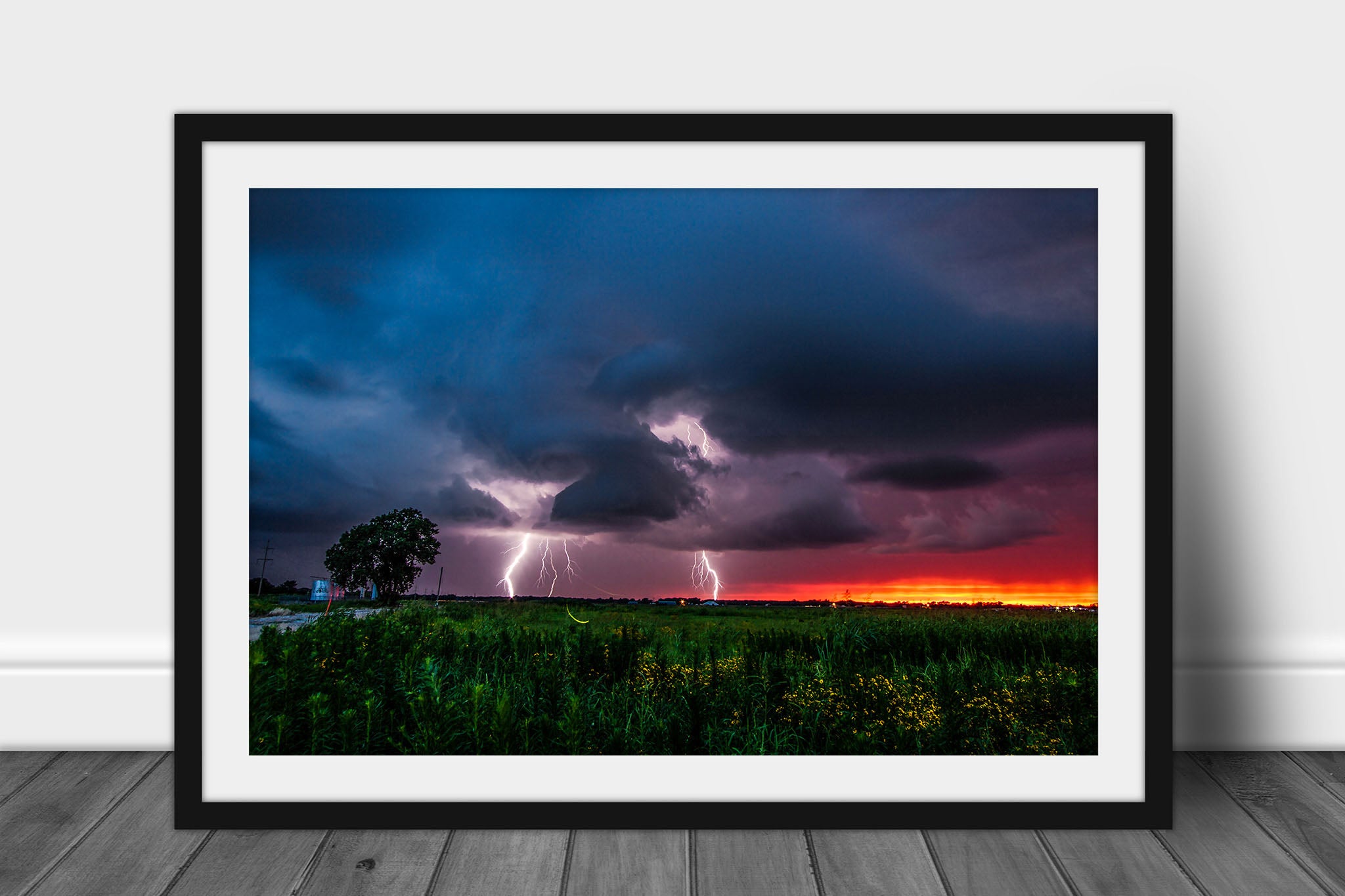Framed and matted storm photography print of lightning strikes as a firefly whirls about at sunset on a stormy summer evening in Oklahoma by Sean Ramsey of Southern Plains Photography.