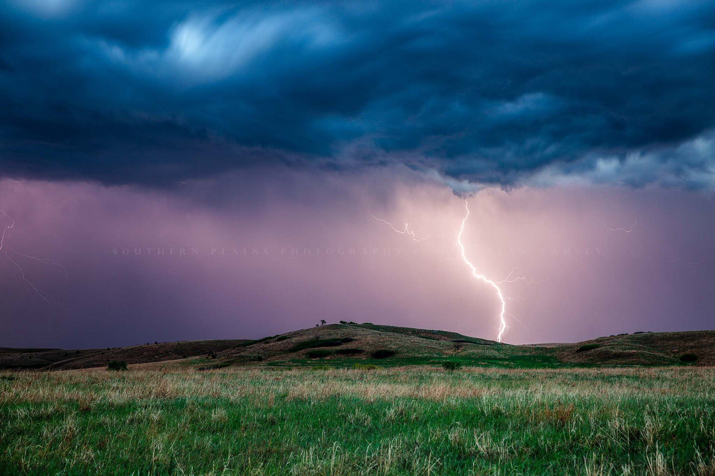 Great plains photography print of lightning striking near a hill on a stormy spring night in Kansas by Sean Ramsey of Southern Plains Photography.
