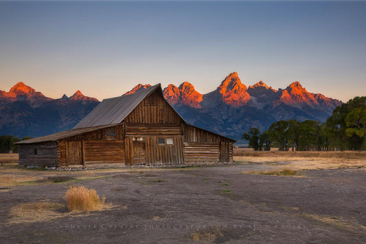 Rocky mountain photography print of Grand Tetons with alpenglow overlooking Moulton Barn on an autumn morning in Grand Teton National Park, Wyoming by Sean Ramsey of Southern Plains Photography.