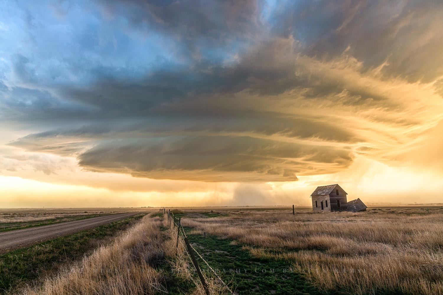 Storm photography print of a supercell thunderstorm over an abandoned house on a spring evening in Colorado by Sean Ramsey of Southern Plains Photography.