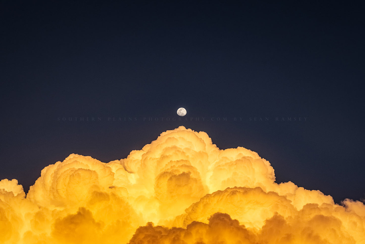 Sky photography print of a Waxing Gibbous moon over billowing cumulonimbus storm clouds on a spring evening in Texas by Sean Ramsey of Southern Plains Photography.