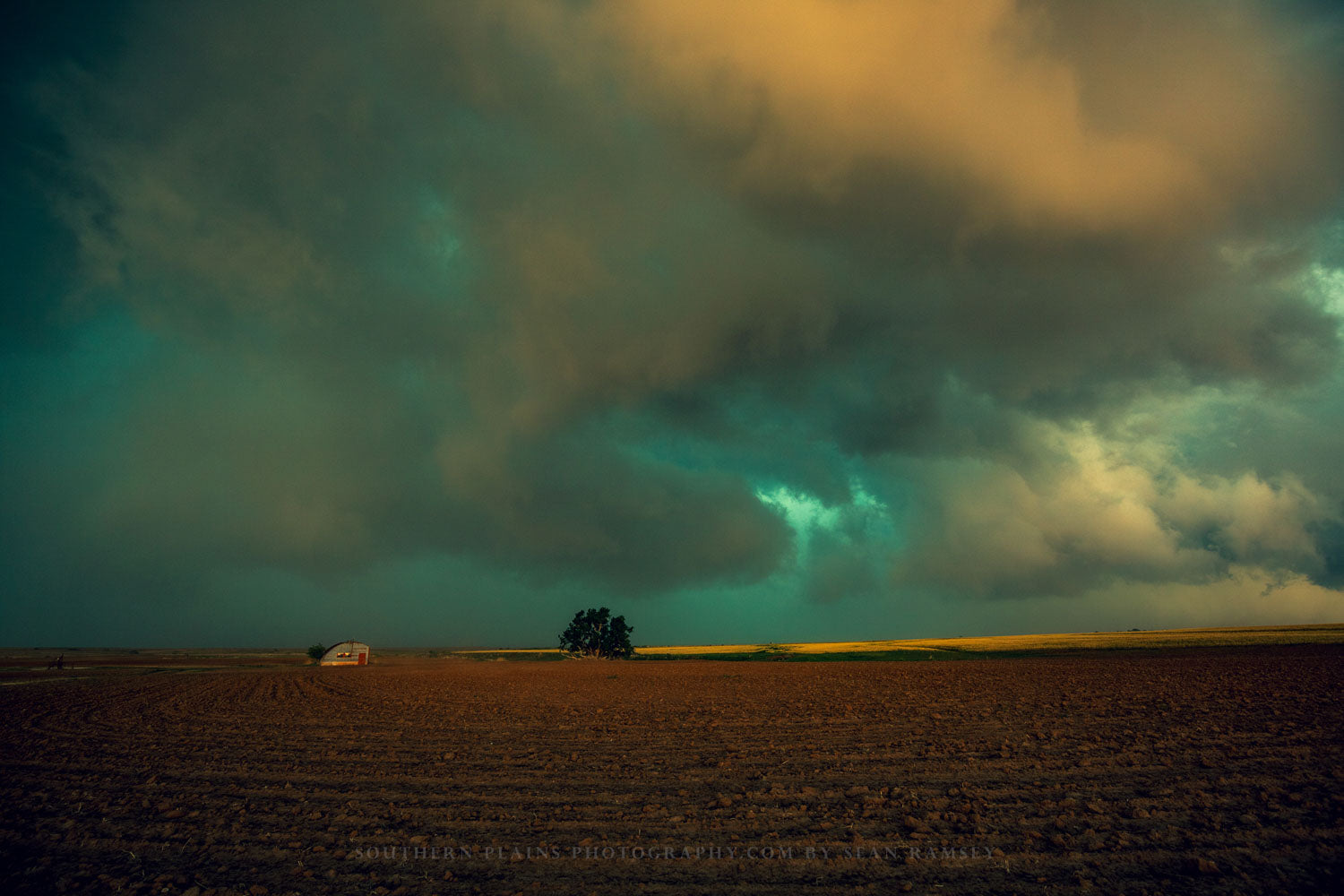 Nostalgic photography print of storm clouds over a field on a farm in Oklahoma by Sean Ramsey of Southern Plains Photography.
