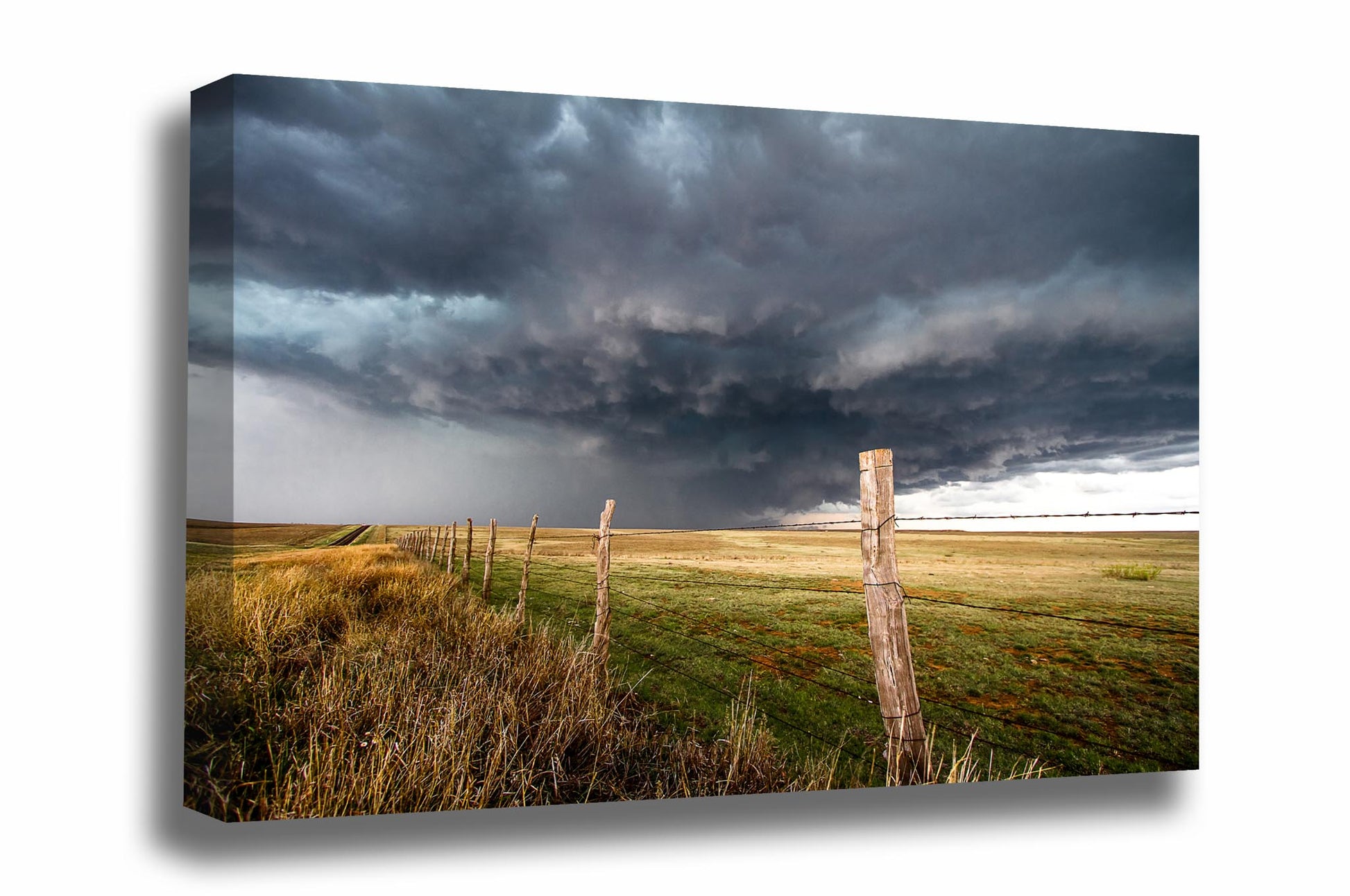 Canvas wall art of a powerful thunderstorm with a gentle appearance over a barbed wire fence on a stormy spring day in the Texas panhandle by Sean Ramsey of Southern Plains Photography.