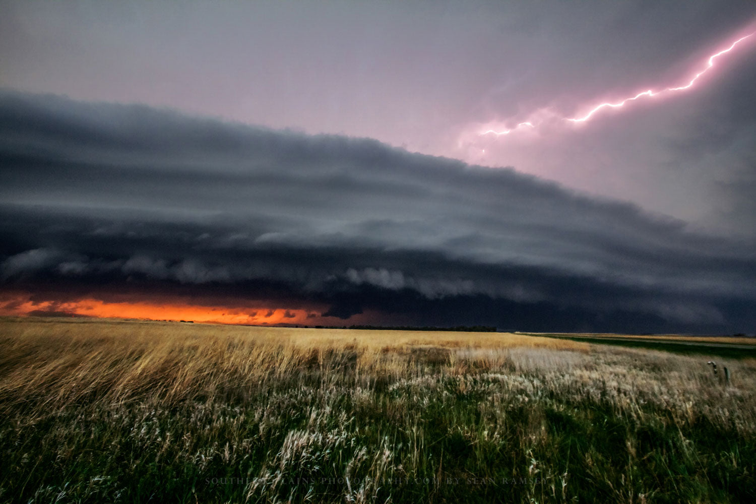 Storm photography print of a supercell thunderstorm spanning the horizon as lightning strikes on a spring evening on the Kansas prairie by Sean Ramsey of Southern Plains Photography.