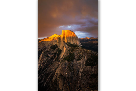 Vertical western landscape photography print of Half Dome drenched in sunlight at sunset on a summer evening in Yosemite National Park, California by Sean Ramsey of Southern Plains Photography.