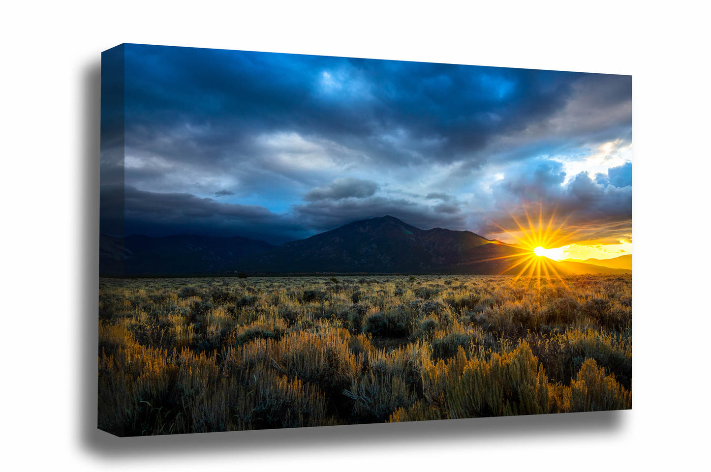 Western canvas wall art of the sun peeking over Taos Mountain and illuminating the sagebrush in the high desert landscape of Taos, New Mexico by Sean Ramsey of Southern Plains Photography.