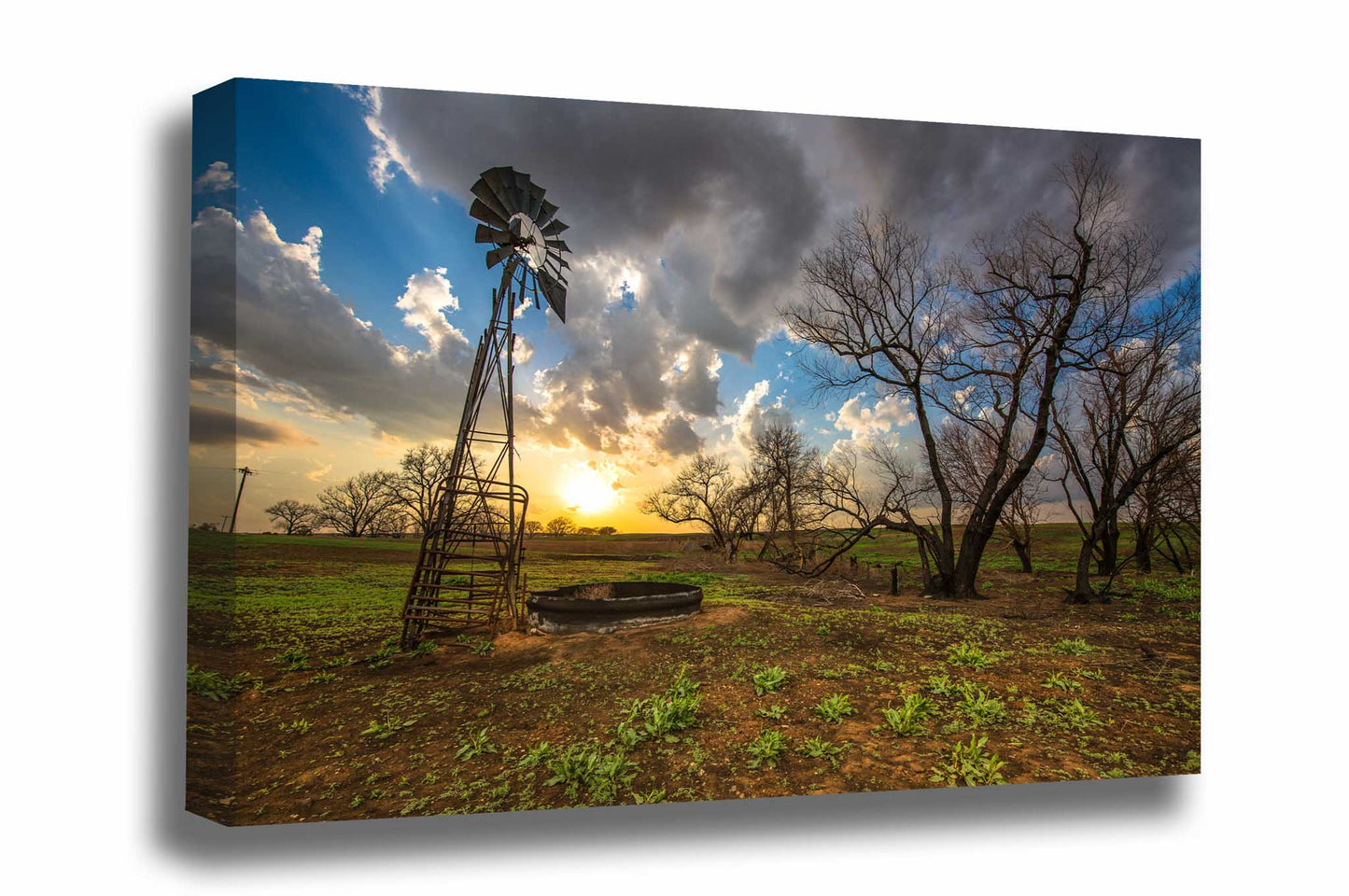 Country canvas wall art of an old windmill and charred trees at sunset on a spring evening in Kansas by Sean Ramsey of Southern Plains Photography.