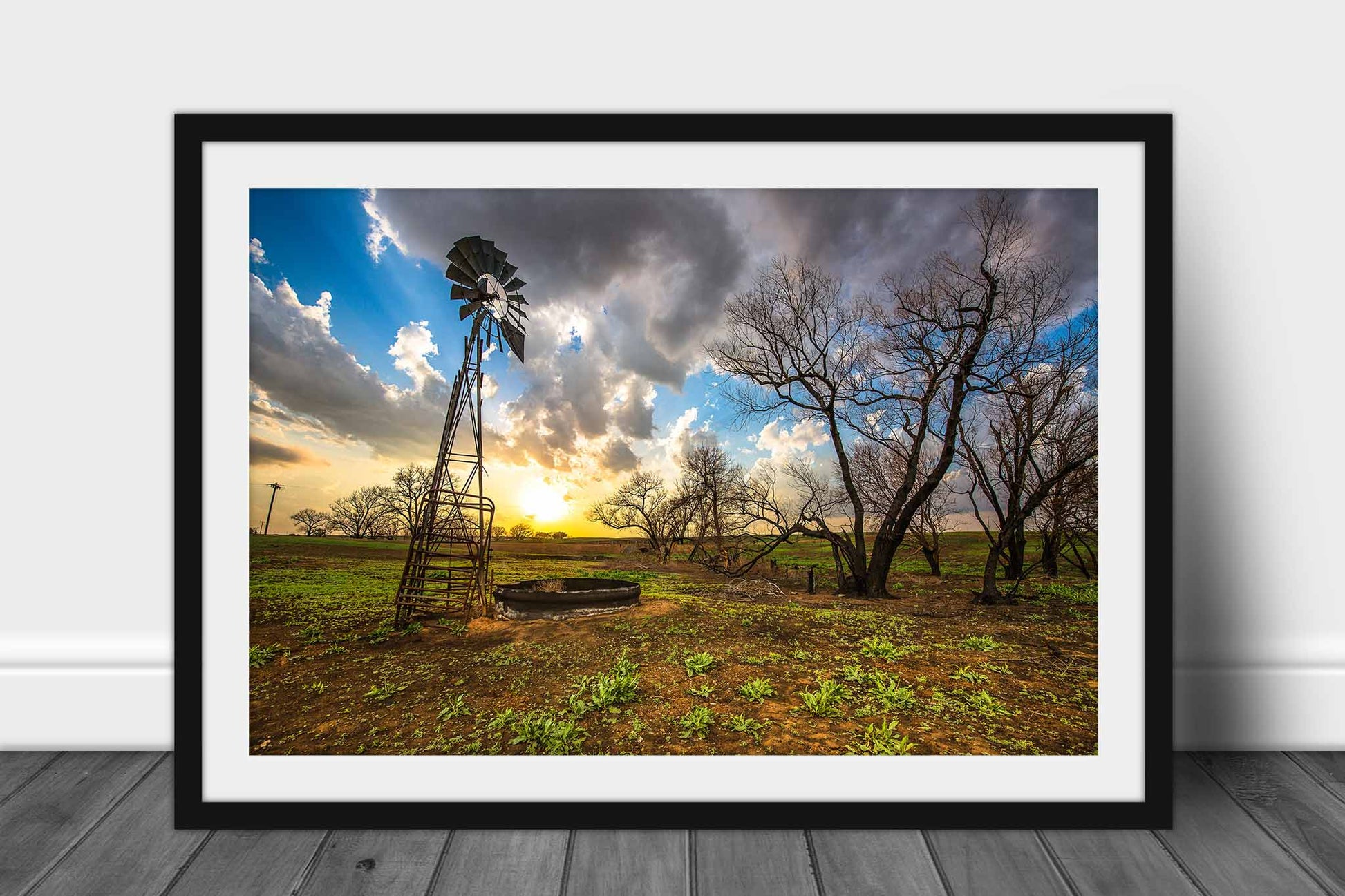 Framed and matted country photography print of an old windmill and charred trees at sunset on a spring evening on the plains of Kansas by Sean Ramsey of Southern Plains Photography.