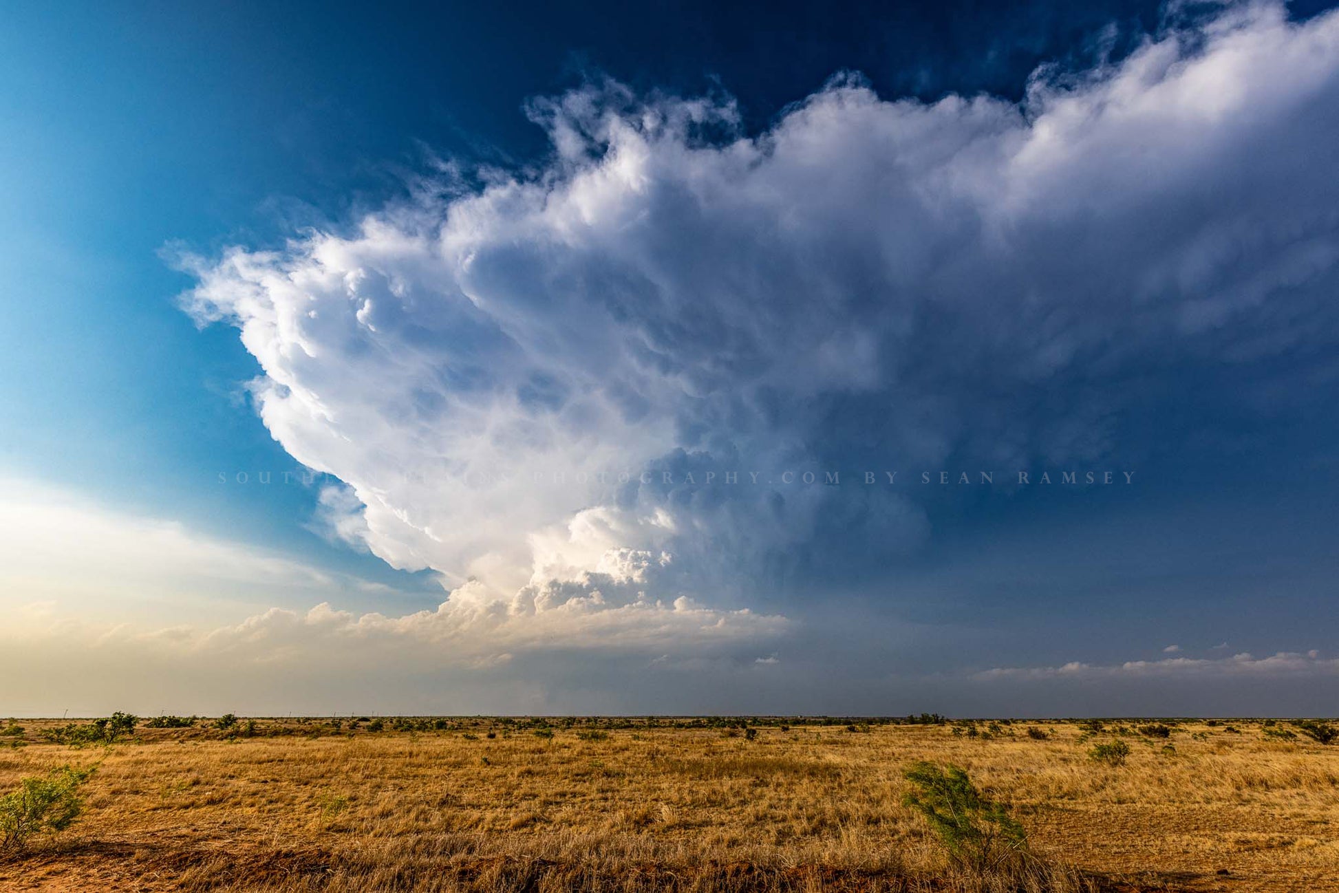 A supercell thunderstorm mesocyclone climbs high into the sky on a stormy spring day on the plains of Texas by Sean Ramsey of Southern Plains Photography.