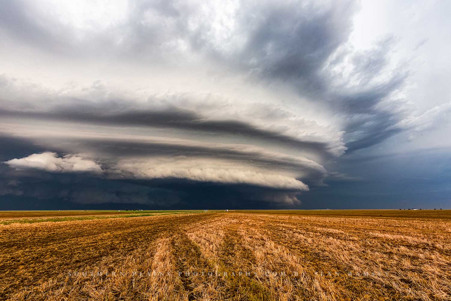 Storm photography print of a supercell thunderstorm advancing over an open field on a stormy spring day on the plains of Kansas by Sean Ramsey of Southern Plains Photography.