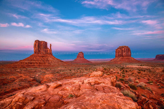 Western landscape photography print of the mittens in Monument Valley against a vivid sky at sunset along the Arizona and Utah border by Sean Ramsey of Southern Plains photography.