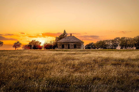 An abandoned house and golden prairie grass drenched in evening light at sunset on an autumn evening in Oklahoma by Sean Ramsey of Southern Plains Photography.