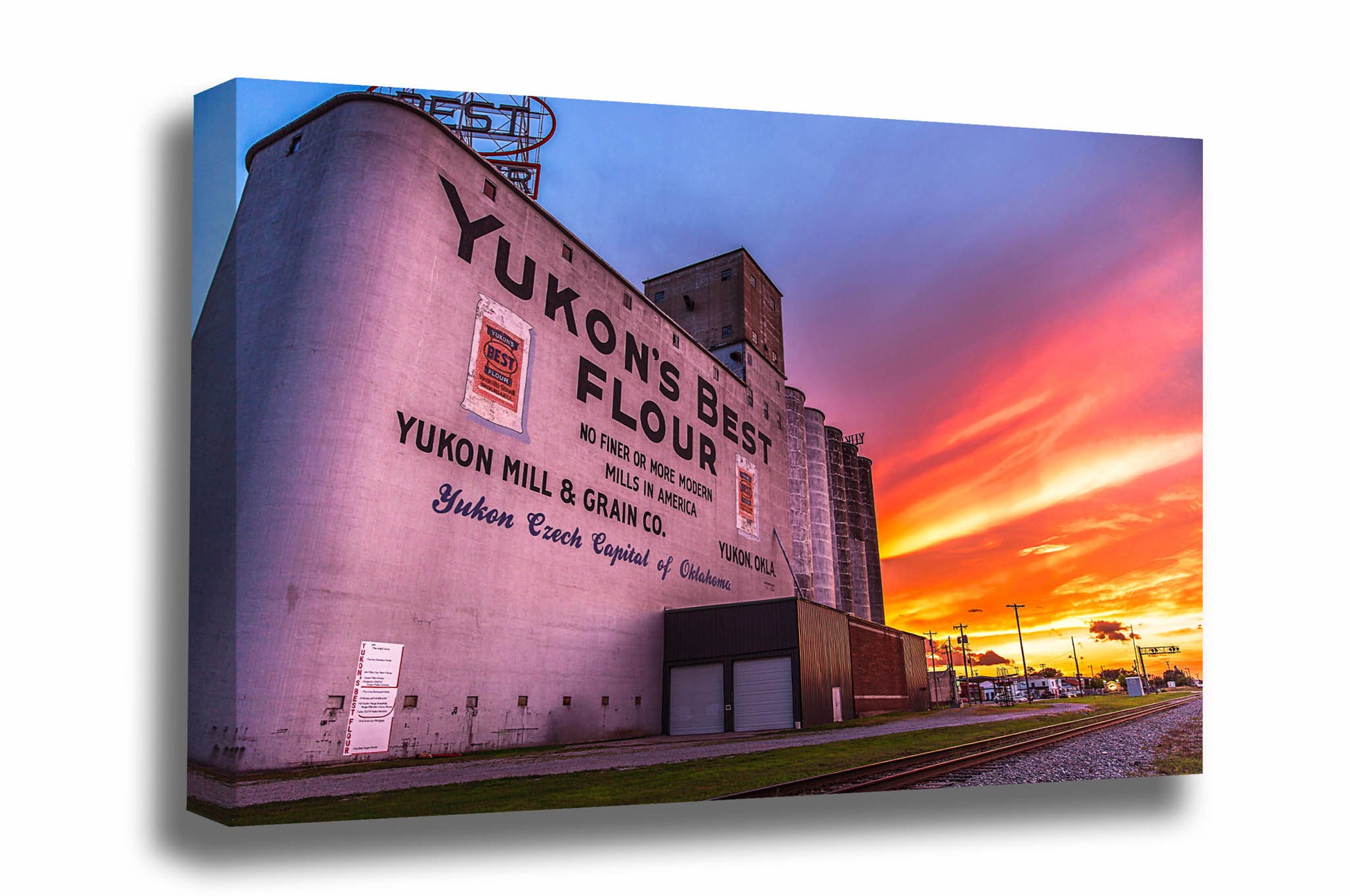 Canvas wall art of Yukon's Best grain elevator at sunset along Route 66 in Yukon, Oklahoma by Sean Ramsey of Southern Plains Photography.